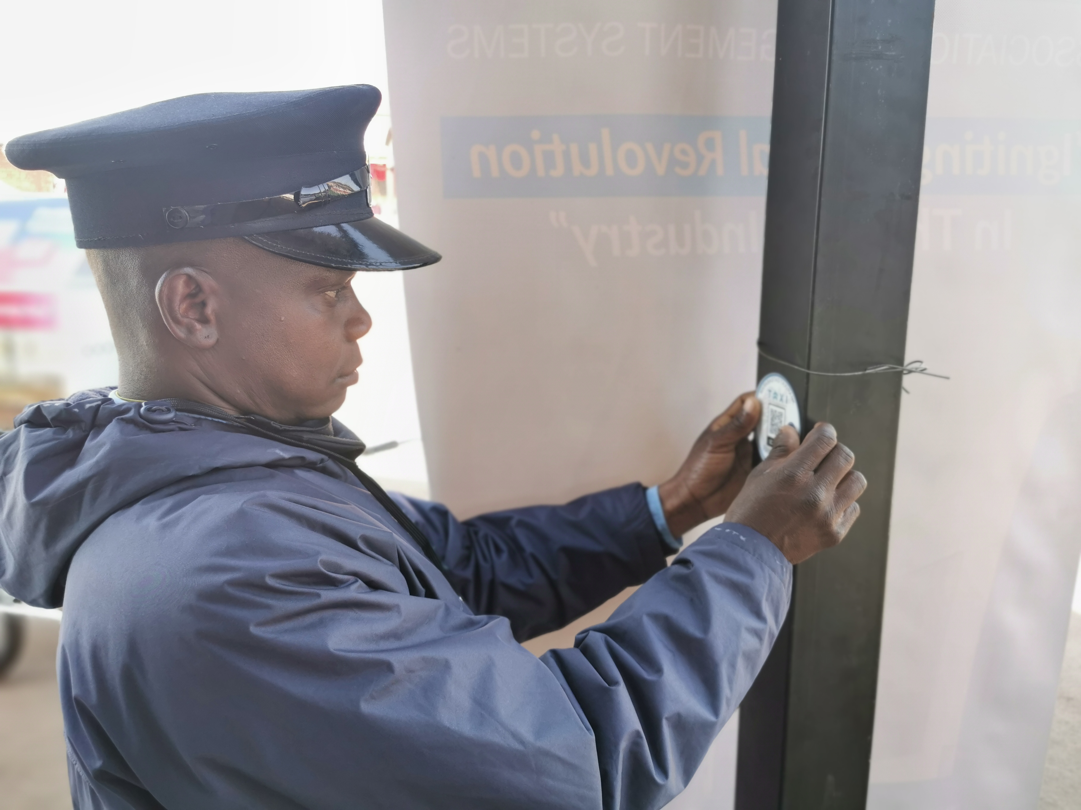 Crew aligning digital kiosk wiring